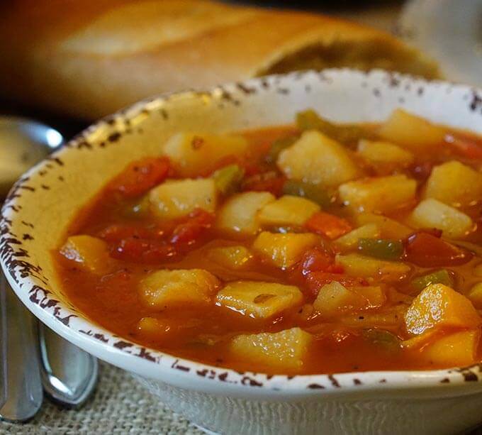 Soup in white bowl with spoon.