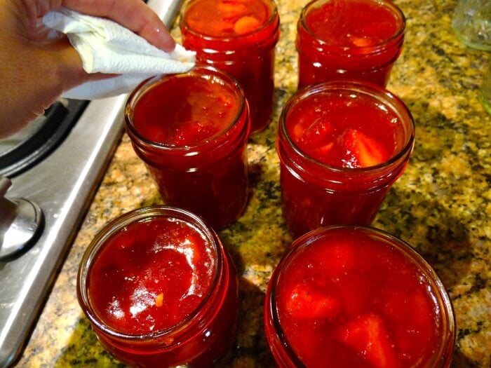 cleaning tops of the jars