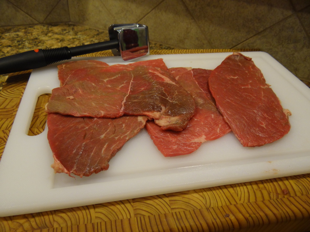 Pound the meat with a mallet until it's thin and tender.