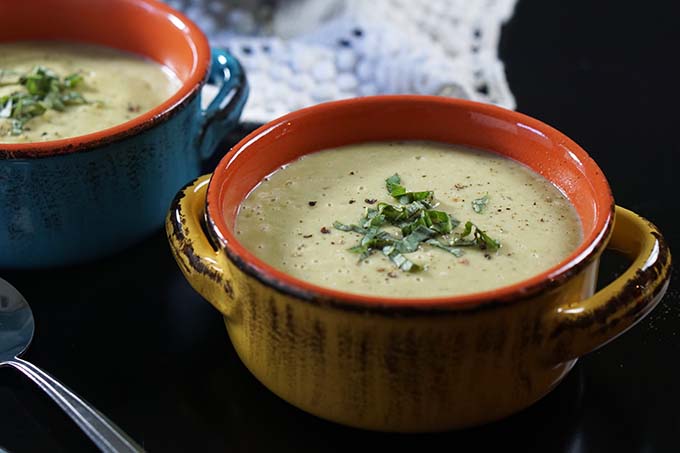 Two bowls of creamy zucchini soup recipe. 