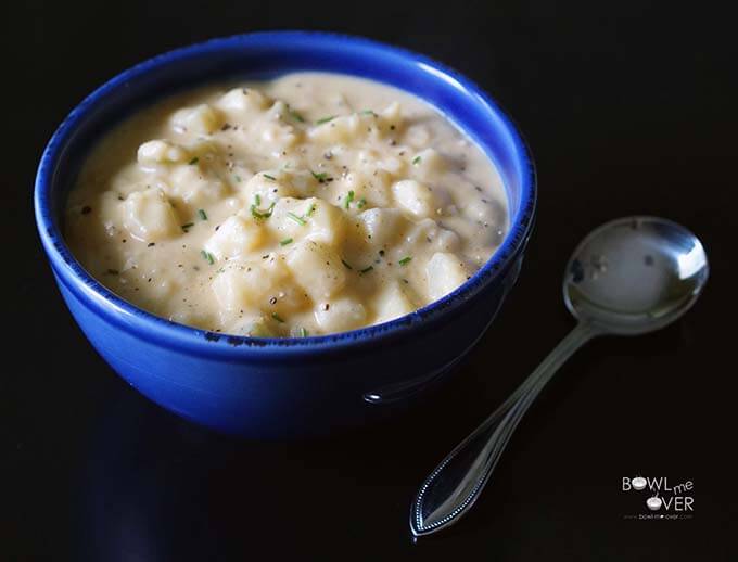 A Blue Bowl Filled With Easy Potato Soup 