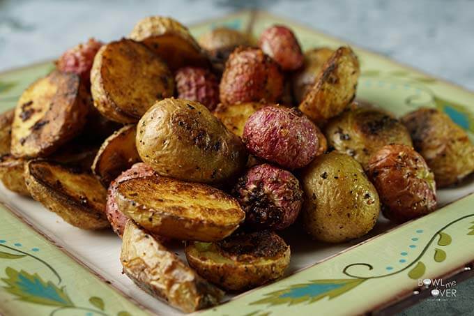 Roasted Radishes Recipe with Potatoes on a green platter.