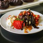 Cake on white plate with strawberries