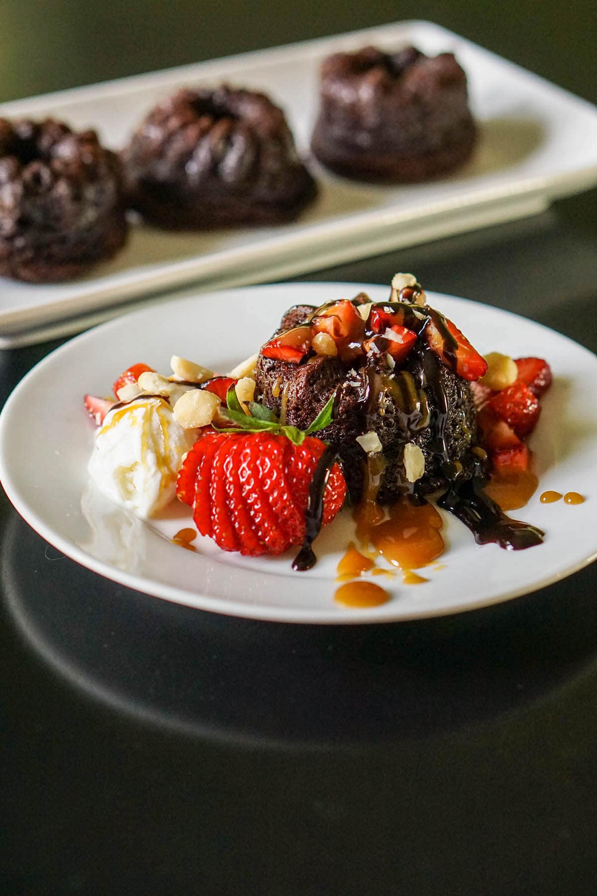 Cake on white plate with strawberries