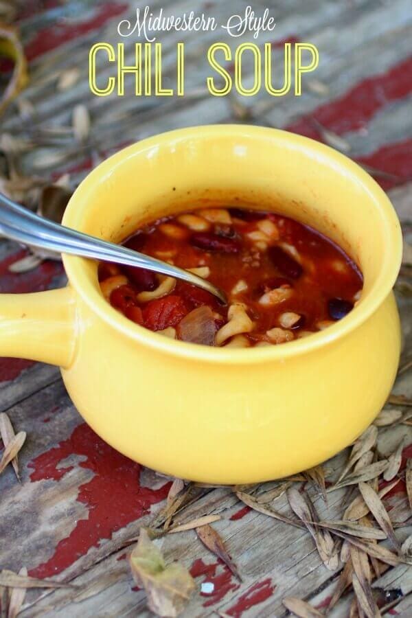 A yellow mug filled to the brim with midwestern style chili.