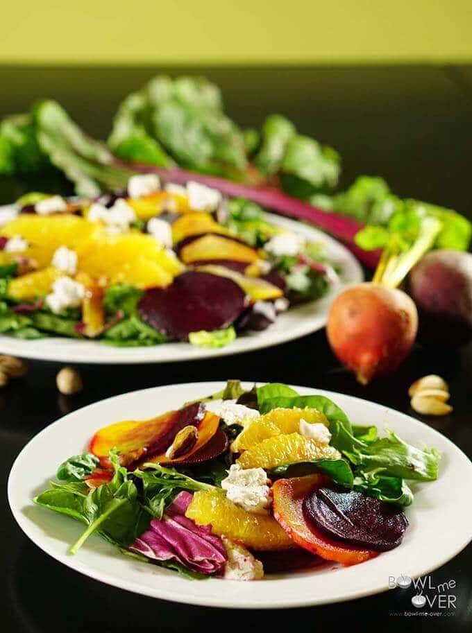 Roasted beet goat cheese salads on plates. 
