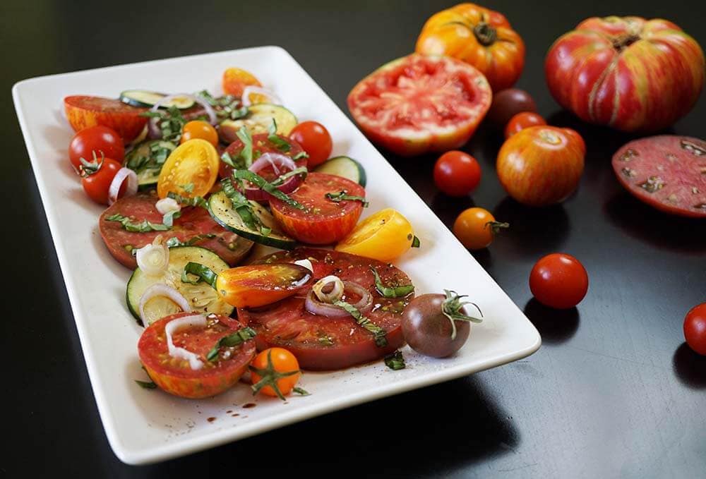 Sliced Tomato Salad on platter. 