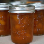 Spiced apricot jam in canning jars.