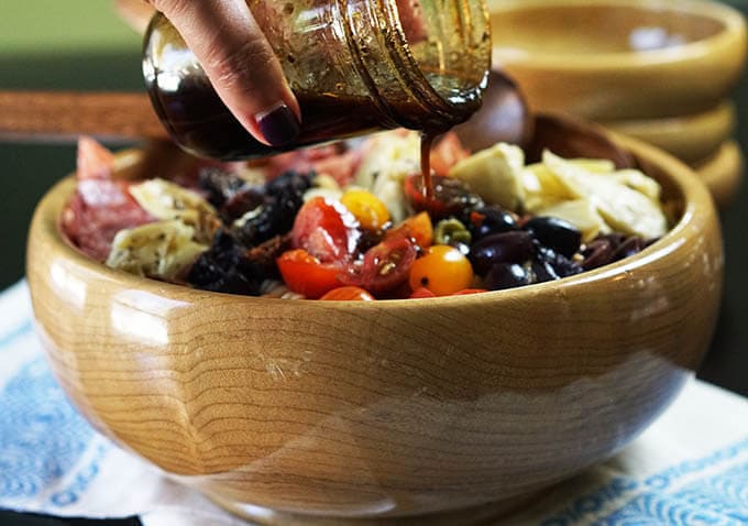 Just pour on your dressing - it's quick, easy, light & perfect for this yummy Antipasto Pasta Salad!