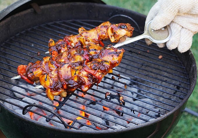 Grilled Chicken skewers on hot grill.