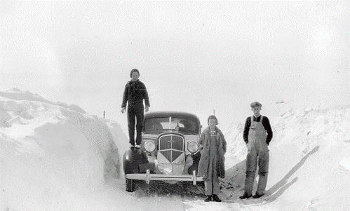 Car in snowdrifts with family