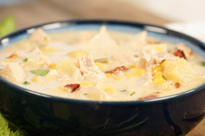 A blue bowl filled with turkey chowder