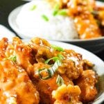White bowls full of sweet Panda Express honey walnut shrimp Recipe, topping off mounds of white rice.