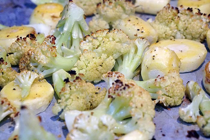 A sheet pan filled with roasted vegetables.