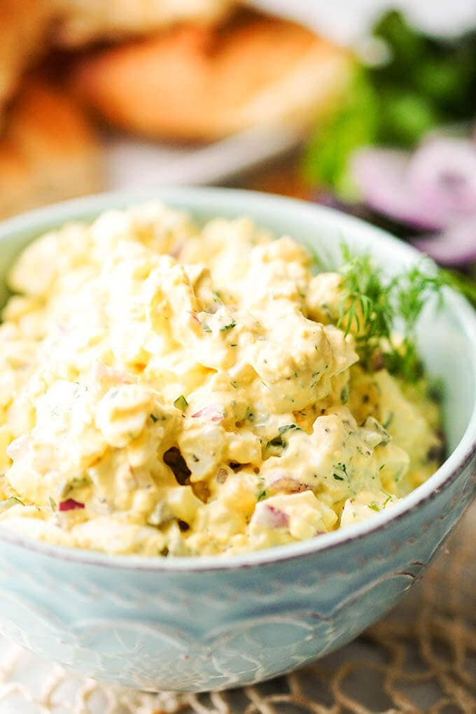 A green bowl filled with egg salad recipe