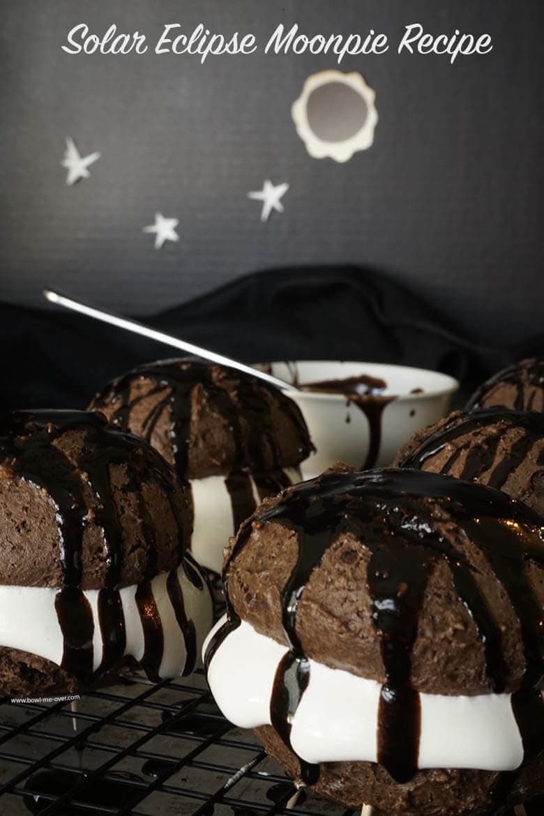 Moon pies drizzled with chocolate icing.