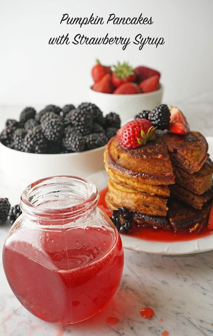 Pumpkin pancakes with strawberry syrup.