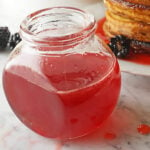 Jar of strawberry syrup.