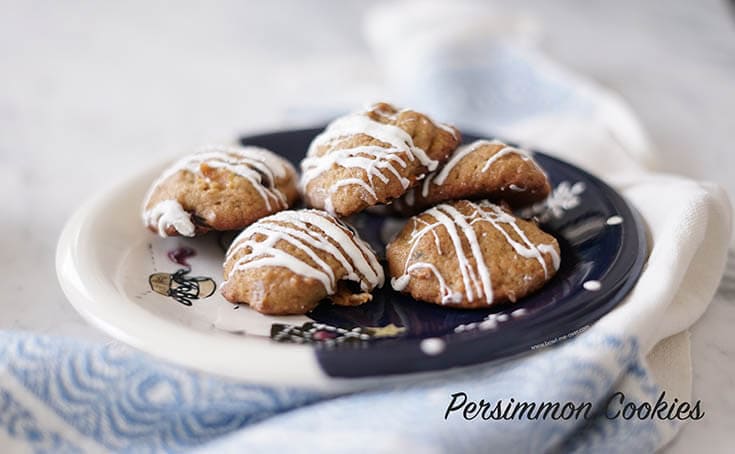 Persimmon Cookies on plate drizzled with white choclate