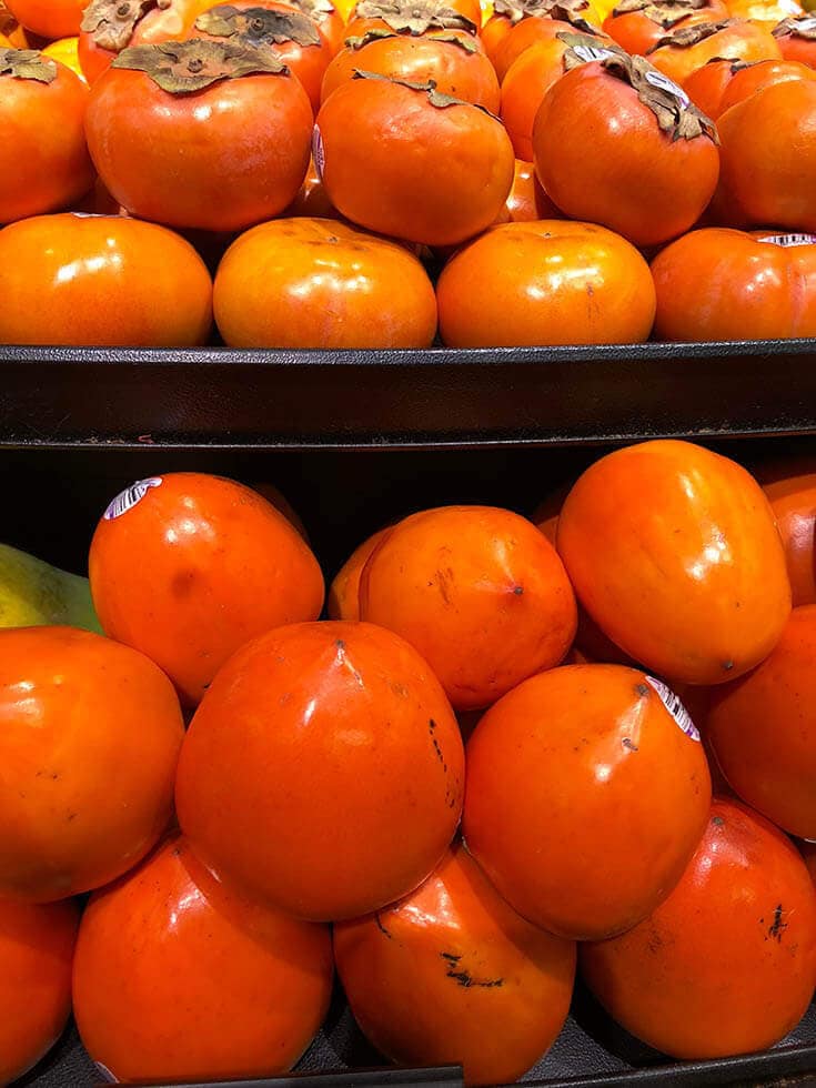 Hachiya and Fuyu persimmons stacked yup.