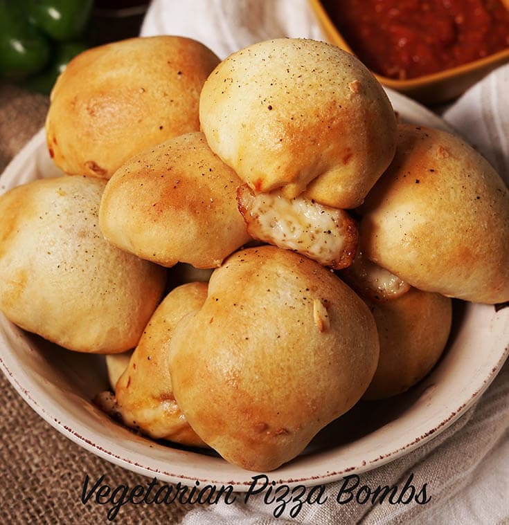 Toasted, golden brown vegetarian pizza bombs on platter.