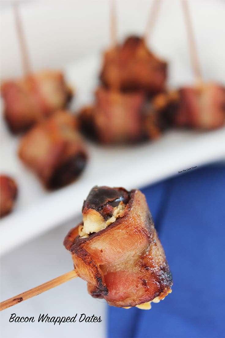 Close up of a Bacon Wrapped Dates Recipe skewered by a toothpick 