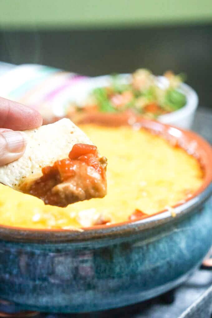 Refried Bean Dip on a tortilla chip.