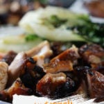 Chicken Teriyaki Bowl with tender grilled chicken thighs piled over white rice with bok choy and pickled ginger.