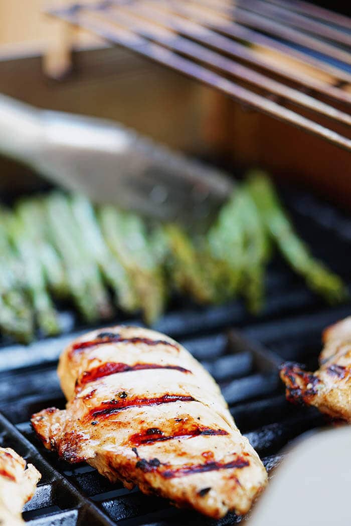 Chicken on the grill with lemon pepper marinade and asparagus