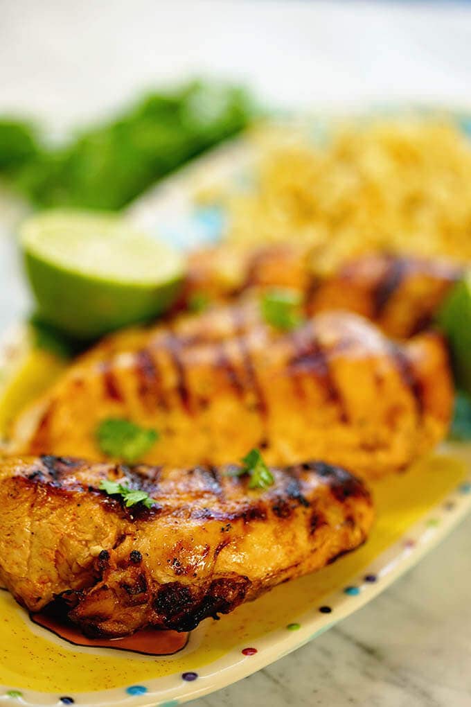 Chili lime chicken marinade - a platter of grilled chicken and corn. Who's hungry?!!!