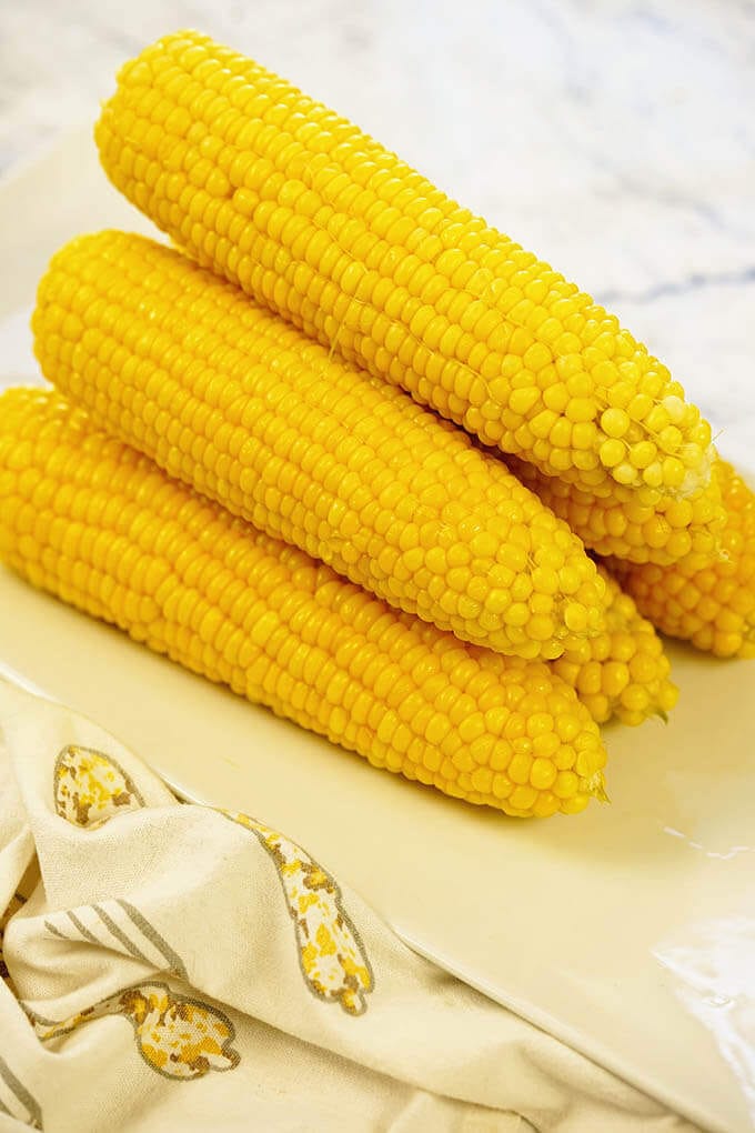 A stack of sweet corn made in the pressure cooker. This is a recipe for Instant Pot Corn on the Cob.