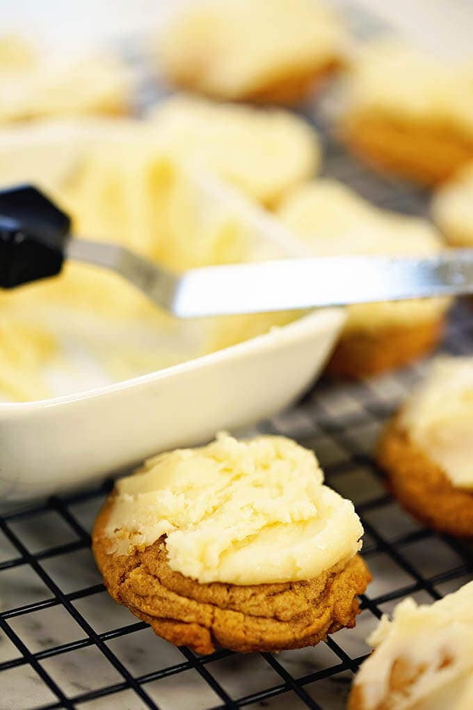 Butterscotch cookie on cooling rack with frosting.