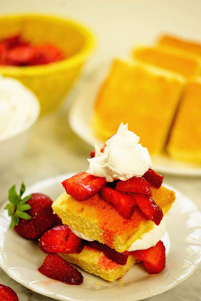 Easy strawberry shortcake recipe with extra servings of cornbread, cream and strawberries