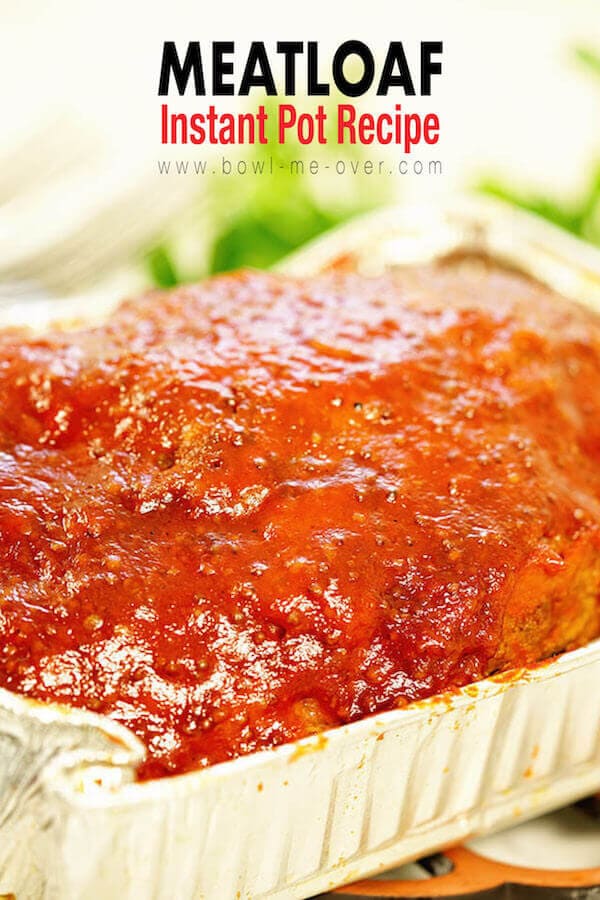 Pressure cooker meatloaf Recipe - Juicy meatloaf in an aluminum pan surrounded by bright green parsley!
