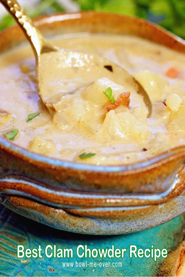 Homemade Clam Chowder in a bowl with a spoon dipping some out!