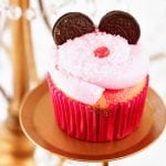 Pink Minnie Mouse Cupcake with Oreo cookie ears and a little red nose.