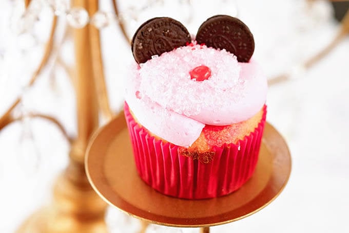 Pink Minnie Mouse Cupcake with Oreo cookie ears and a little red nose.