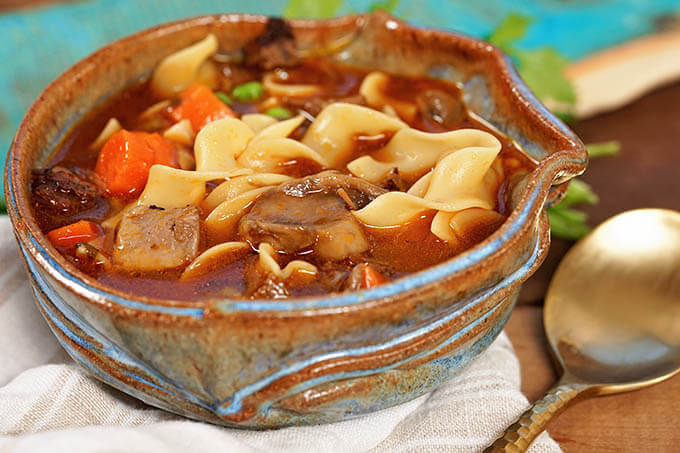 A blue bowl filled with Beef Noodle Soup Recipe