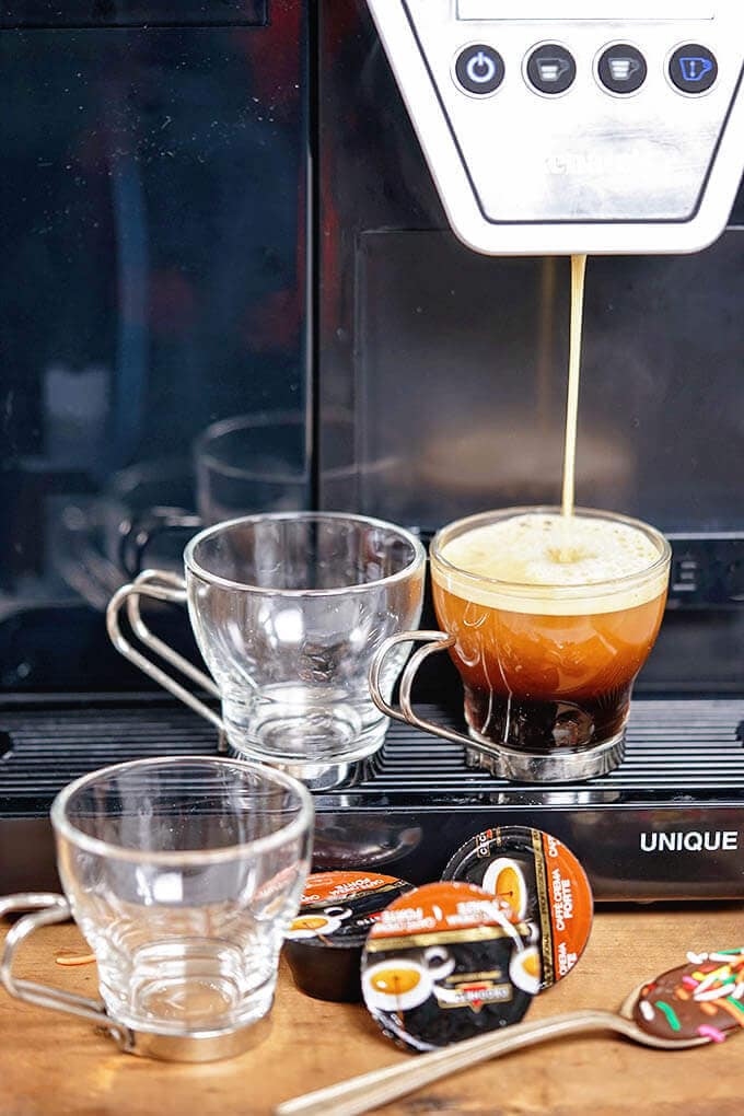 Coffee machine making espresso.