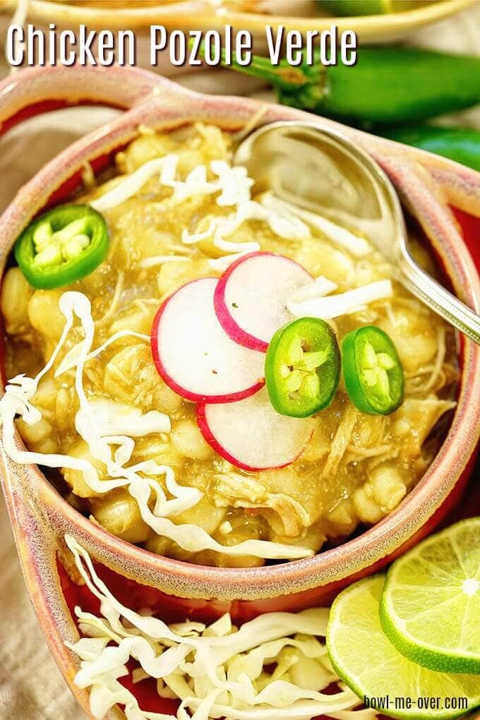 Chicken Pozole Verde topped with cabbage, radishes and sliced jalapeños