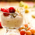 Make ahead breakfast Yogurt parfait topped with raspberries and sliced almonds