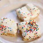 Lemon bars on white plate.