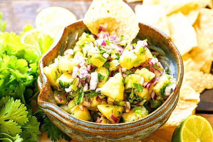 Pineapple Salsa in blue bowl with chips