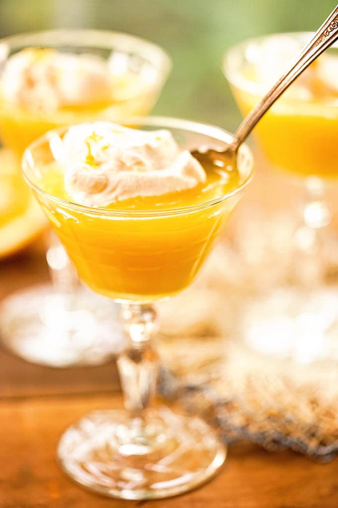 Meyer Lemon Curd served with a dollop of whipped cream.