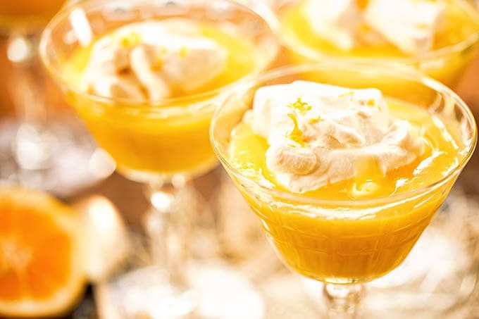 Lemon Curd served with whipped cream.