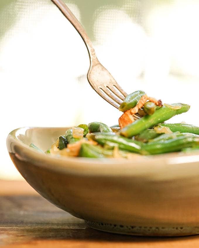 String Beans in bowl with fork.