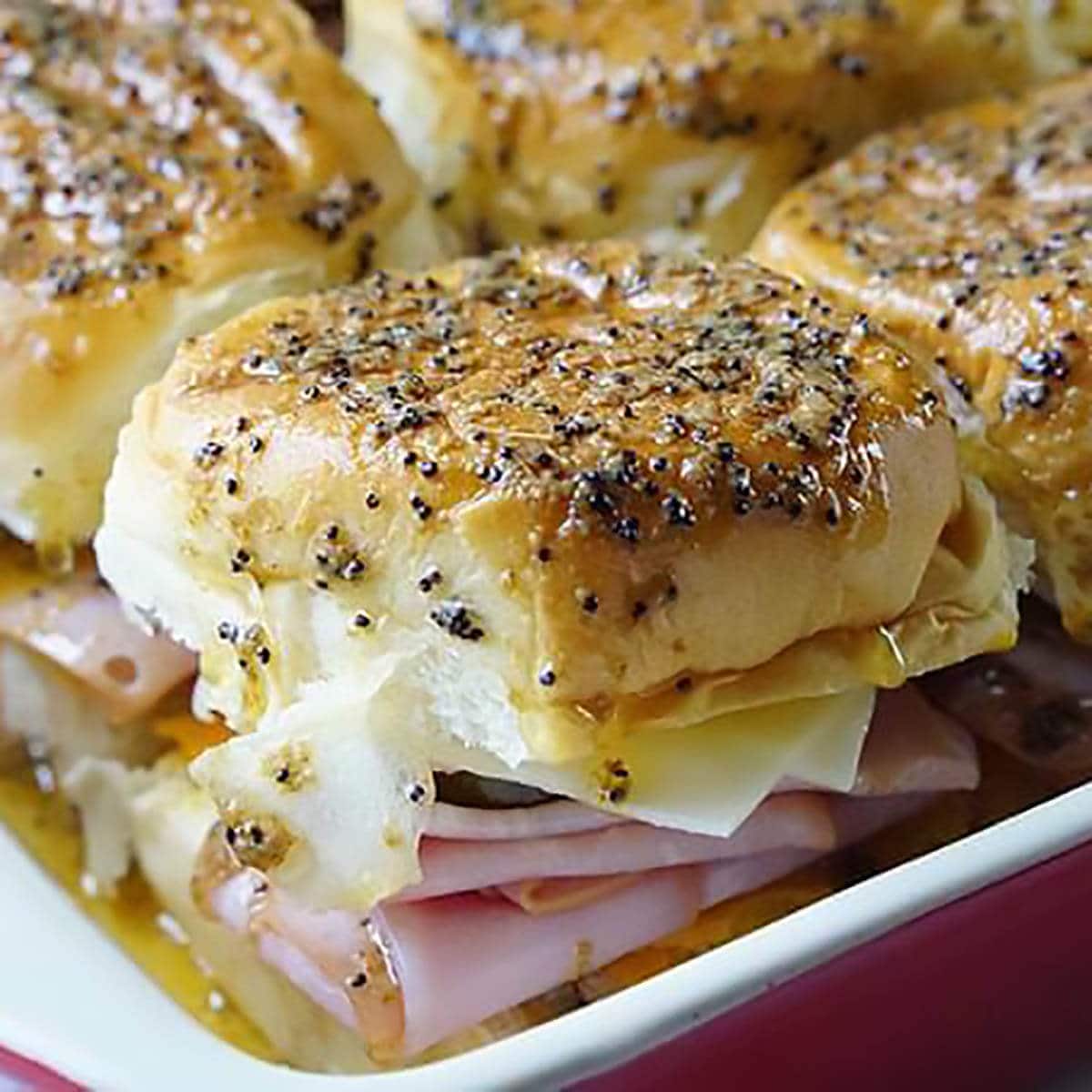 Mini Cuban Slider Sandwiches in a pan.