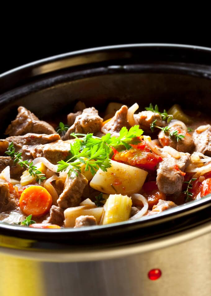 Beef stew cooking in crockpot.