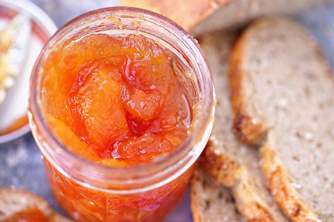 Homemade Jam in a jar with bread