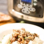 Crockpot Beef Stroganoff in bowl over rice.